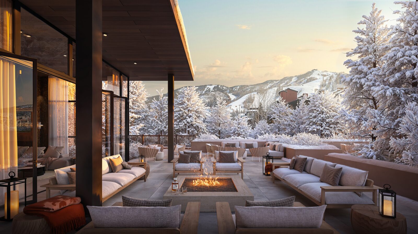 Owners Club terrace with fire pit and snowy mountain views.