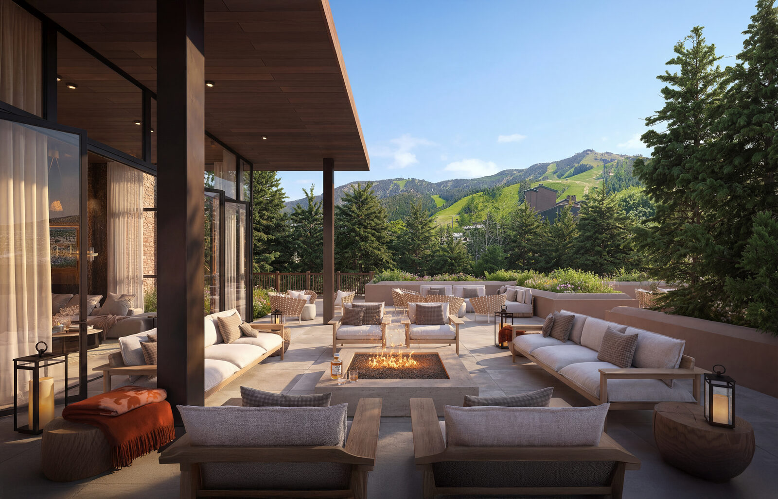 Wildair Owners Club terrace with fire pit, lounge seating and summer views toward the Steamboat ski slopes