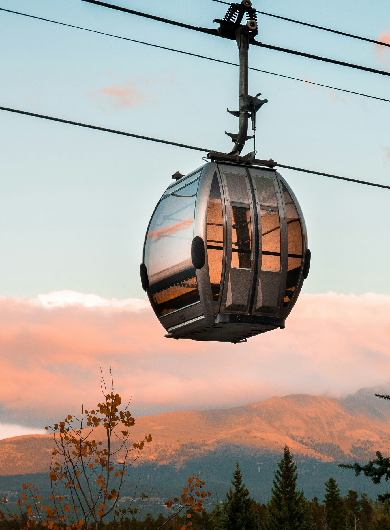 Mountain gondola at sunset.